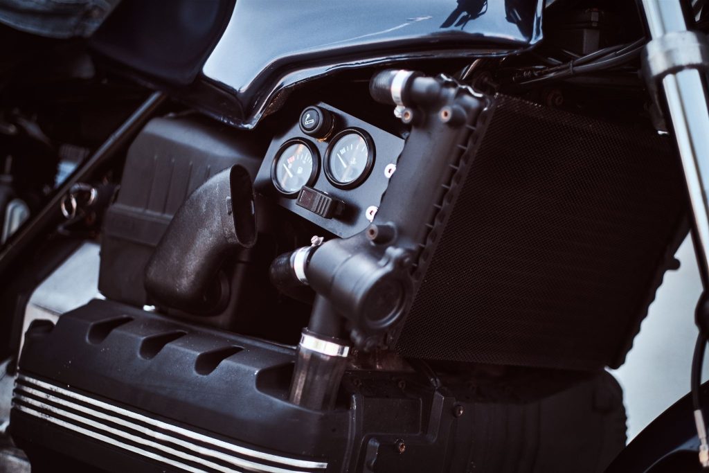 What are the main motorcycle engine types and how do they differ?